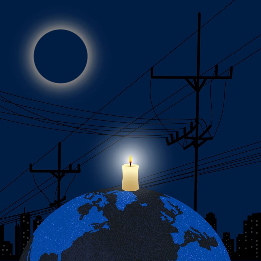 Imagen conceptual de un apagón global con una vela como única fuente de luz, representando la vulnerabilidad de la sociedad tecnológica.